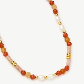 Missoma bracelet in gold red, featuring mixed carnelian, pink, and freshwater pearl beads with gold rondelle spacers