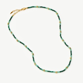 Missoma gold and green beaded necklace with gold spacer beads and lobster clasp fastening
