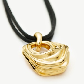 Missoma Gold Cord necklace with sculptural layered gold-tone pendant on a black double-strand cord