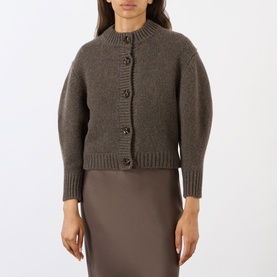 Model wearing Soeur brown merino wool cardigan with button front, cropped silhouette and ribbed cuffs, styled with a brown midi skirt.
