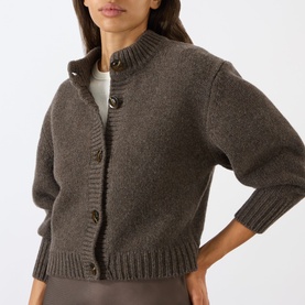Model wearing Soeur brown merino wool cardigan with funnel neck, ribbed hem and cuffs, and large button fastening.