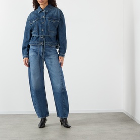 Model wearing Soeur mid blue denim jacket styled with matching wide-leg denim jeans and black heeled ankle boots