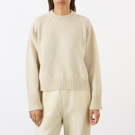 Model wearing Soeur ecru chin&eacute; merino wool crew neck jumper with ribbed cuffs and hem, styled with matching ecru trousers