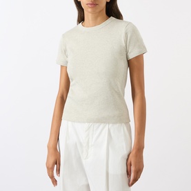 Model wearing Soeur charcoal cotton T-shirt with crew neck and short sleeves, styled with white wide-leg trousers