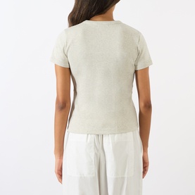 Model wearing Soeur charcoal cotton T-shirt, short sleeves, ribbed texture, back view, styled with white wide-leg trousers
