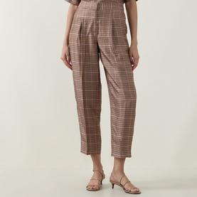 Model wearing Ted Baker beige check tailored trousers with a straight cropped leg, styled with nude heeled mules.