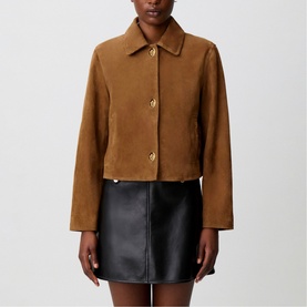 Model wearing Claude Pierlot tan suede-effect cropped jacket with gold buttons, styled with a black mini skirt