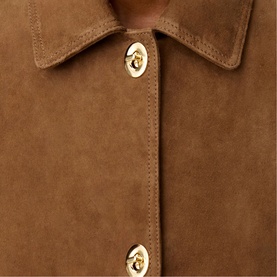 Claude Pierlot women's suede-effect jacket in tan, featuring gold twist-lock buttons and a classic collar, close-up detail view.