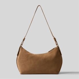 Claude Pierlot shoulder bag in tan suede with gold-tone hardware and single adjustable strap, crescent silhouette