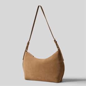 Claude Pierlot tan suede shoulder bag with gold-tone hardware, adjustable strap, and zip detail