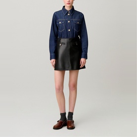 Model wearing Claude Pierlot Womens French Dress in blue denim, styled with black leather mini skirt and brown loafers