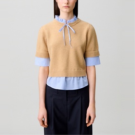 Model wearing Claude Pierlot Stripe Hybrid Sweater in clear, short-sleeve wool knit with striped poplin hem and Victorian collar with bow tie