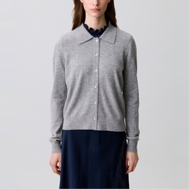 Model wearing Claude Pierlot Fine Knit Cardigan in mottled grey, shirt collar, front button placket, styled over a navy shirt and skirt.