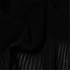 Claude Pierlot Rib Knit Skirt in black, showing ribbed knit texture with opaque upper and sheer lower section detail.