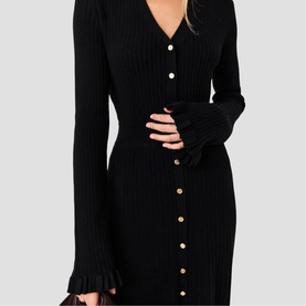 Model wearing Maje Womens French Dress in red, ribbed knit with button-through front, V-neck and frill cuffs