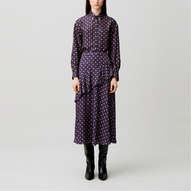 Model wearing Claude Pierlot Womens French Dress in navy print, featuring geometric pattern, button-through bodice and midi skirt, styled with black
