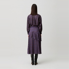 Model wearing Claude Pierlot Womens French Dress in navy print, long sleeves and midi skirt with polka dot pattern, styled with black boots