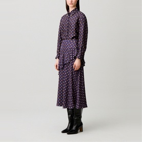 Model wearing Claude Pierlot Womens French Dress in navy print with floral pattern, midi length, long sleeves, styled with black heeled boots