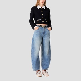 Model wearing Maje red Womens French Dress styled with light blue wide-leg jeans, white collar detail, gold buttons, and white trainers.