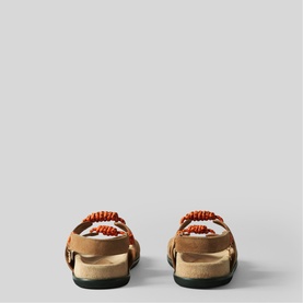 Claude Pierlot brown suede sandals, back view, featuring red beaded strap detail and tan footbed with buckle fastening.