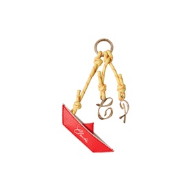 Chlo&eacute; red leather bag charm with gold-tone script letter pendants and tan knotted cord, gold ring attachment