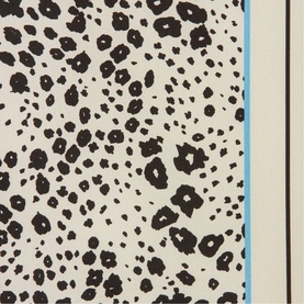 Cream and black leopard print scarf with blue border edge detail, close-up of pattern and texture