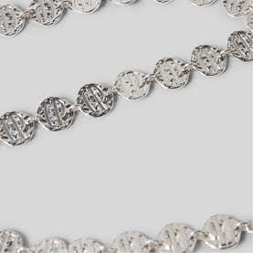 Silver-tone chain necklace with circular filigree links, shown in close-up detail against light grey background