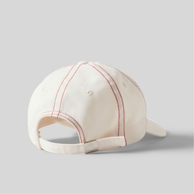 Cream cotton baseball cap, rear view, with contrast red stitching detail and adjustable back strap closure