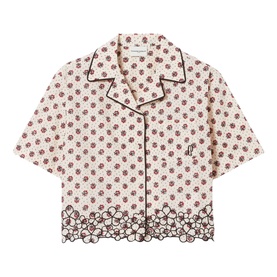 Cream short-sleeve cropped shirt with ditsy floral print, dark floral border hem, contrast piping, and camp collar