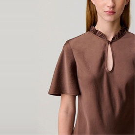 Model wearing Claude Pierlot Womens French Dress in Brown Ice, featuring ruffle neckline, keyhole detail, and flutter sleeves