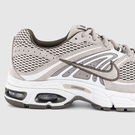 Nike men's trainer in college grey, featuring mesh upper, suede overlays, visible Air cushioning unit and white sole with Cushlon midsole detail