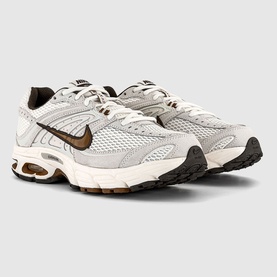 Nike men's trainer in Phantom Tan Sail Baroque colourway, mesh and suede upper, brown Swoosh, gum rubber sole, pair angled view.