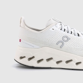 On Running men's trainer in white, featuring knit upper, branded heel tab, and chunky segmented white sole unit