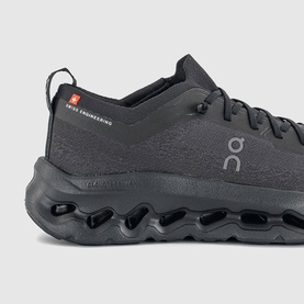 On Running trainer in black with knit upper, lace fastening, and signature CloudTec cushioned sole unit.