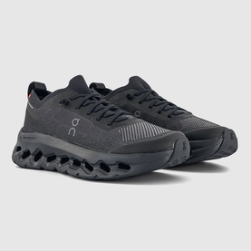 On Running trainers in black, featuring mesh upper, lace-up fastening, and chunky CloudTec sole unit.