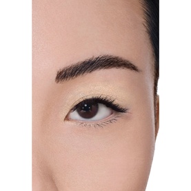 Model with Chanel 3-In-1 Eyeshadow-Eyeliner-Kohl Pencil in Baby Yellow, shown as a soft wash of colour on the eyelid with defined brows.