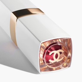 Chanel Hydrating Beautifying Tinted Lip Balm in Electric Vibe, white and gold case with transparent base revealing red-pink balm