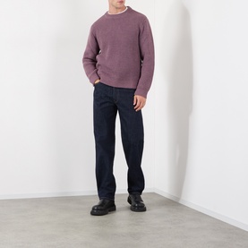 Model wearing Edwin Crew Neck in Grape Nectar, styled with dark navy jeans and black chunky-soled boots.