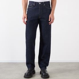Model wearing Edwin 3049 Loose Jeans in blue rinsed, styled with black leather shoes. Relaxed straight-leg fit in dark indigo denim.
