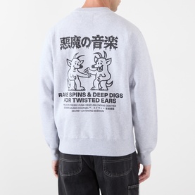 Model wearing Edwin Grey Marl sweatshirt, back view showing Japanese text and cartoon graphic print, styled with dark jeans.