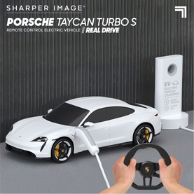Sharper Image Porsche Taycan Turbo S RC Car in red, shown with steering wheel remote control and USB-C charging station
