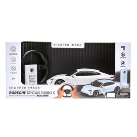 FAO Sharper Image Porsche Taycan Turbo S RC toy car in white, shown in retail packaging with steering wheel controller