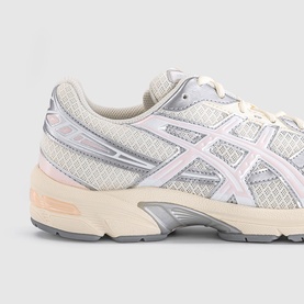 Asics trainer in cream and pink cloud colourway, mesh upper with silver logo, chunky off-white midsole and peach accent cushioning detail.