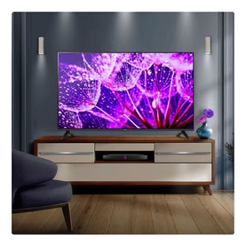 LG 43 Inch Full HD HDR LED Smart TV in black, displayed on a wooden media unit in a styled living room setting