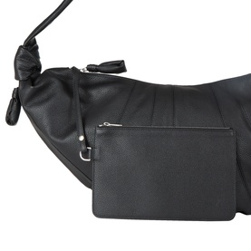 Lemaire Croissant Large Bag in black leather, close-up showing side zip pocket, knot detailing and silver-tone hardware