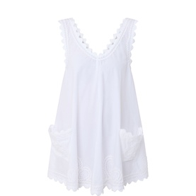 Juliet Dunn Embroidered Low Back Mini Dress in white with V-neckline, scalloped lace trims, patch pockets, and flared silhouette