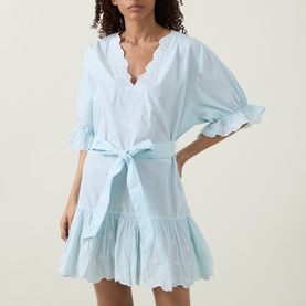 Model wearing Poplin Tie Waist Dress in ice blue, featuring V-neckline, self-tie waist, ruffled sleeves and tiered hem