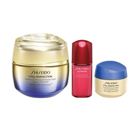 Shiseido Vital Perfection Lift and Firm Expert Gift Set featuring three skincare products: large cream jar, red serum bottle, and mini cream pot.