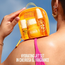 Sol de Janeiro Hydrating Jet Set Cheirosa 62 travel skincare set in yellow zip bag, held against model's sun-kissed back