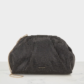 Ted Baker black clutch bag with all-over gold stud embellishment, ruched silhouette, and fine gold chain strap